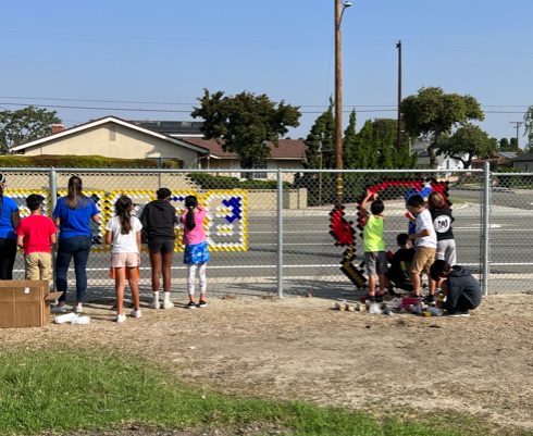 Students putting up School Logo